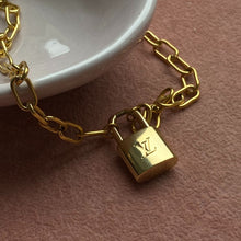 Load image into Gallery viewer, Authentic Louis Vuitton Raye Cabas Padlock M Pendant- Reworked Necklace